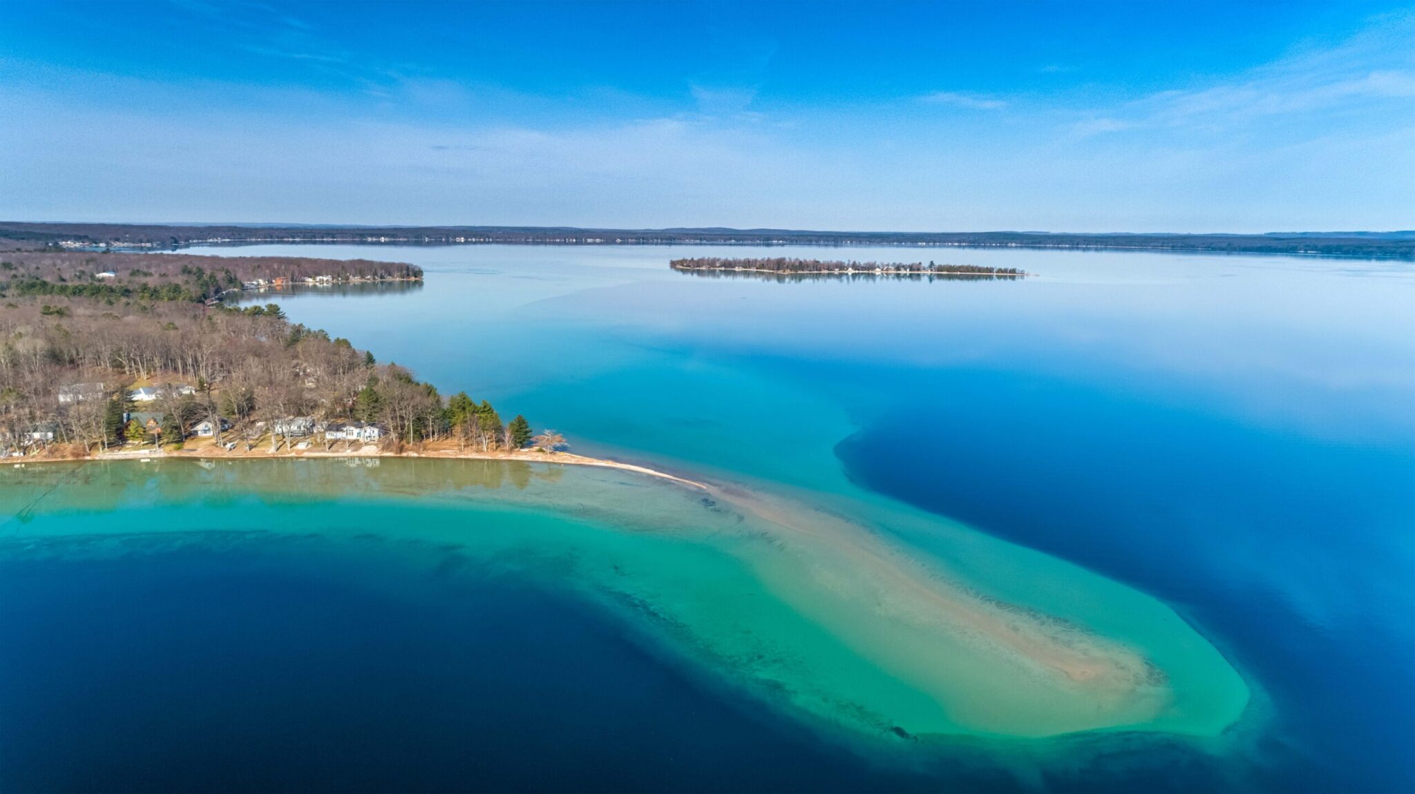 Aerial view of Higgins Lake shoreline and blue water